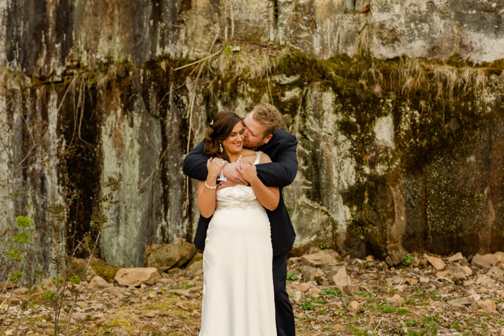 destination wedding photos of couple holding each other in front of boulder mountain for an elopement